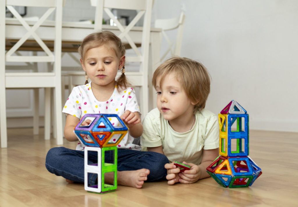 Having fun with magnetic tiles for kids.