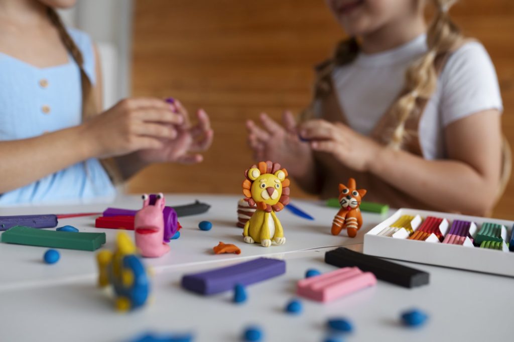 Kids playing with playdough.