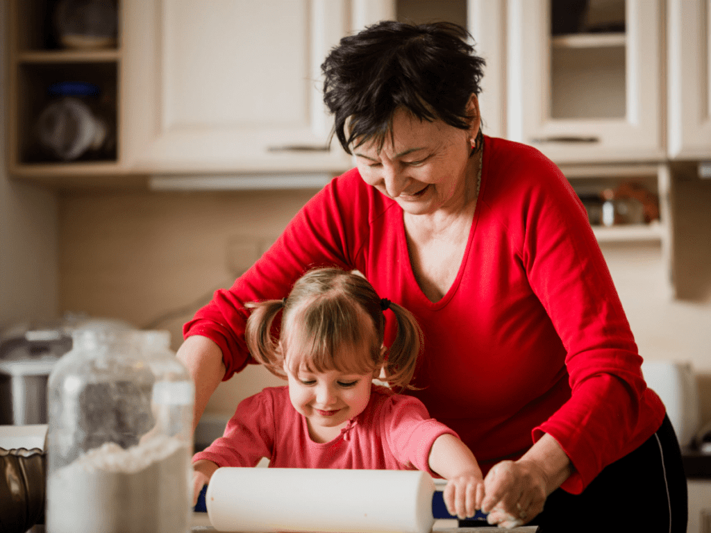 Grandmother cooking with Granddaughter. 