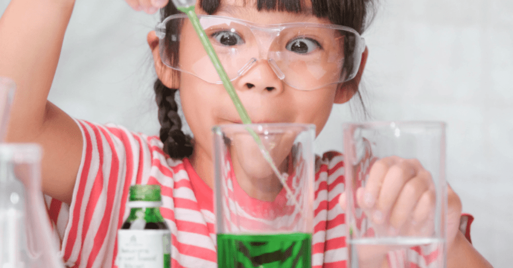 Girl doing a science experiment. 