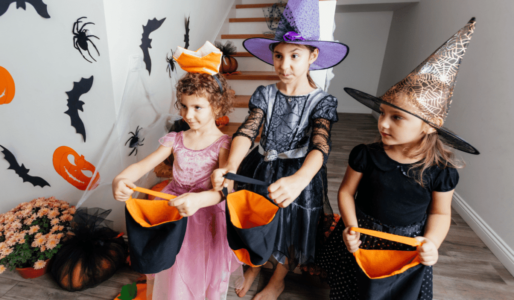 3 girls trick or treating. 