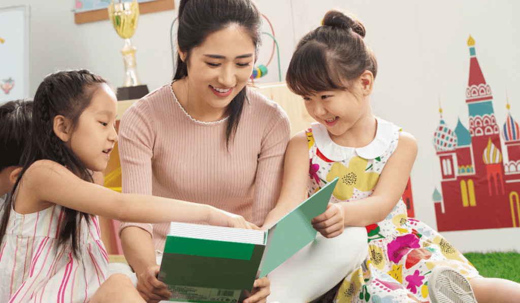 Mom interacting with daughters  during stem storytime.  