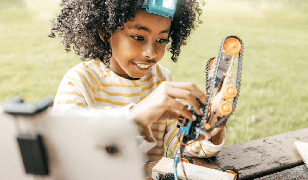 Girl programming a robot.