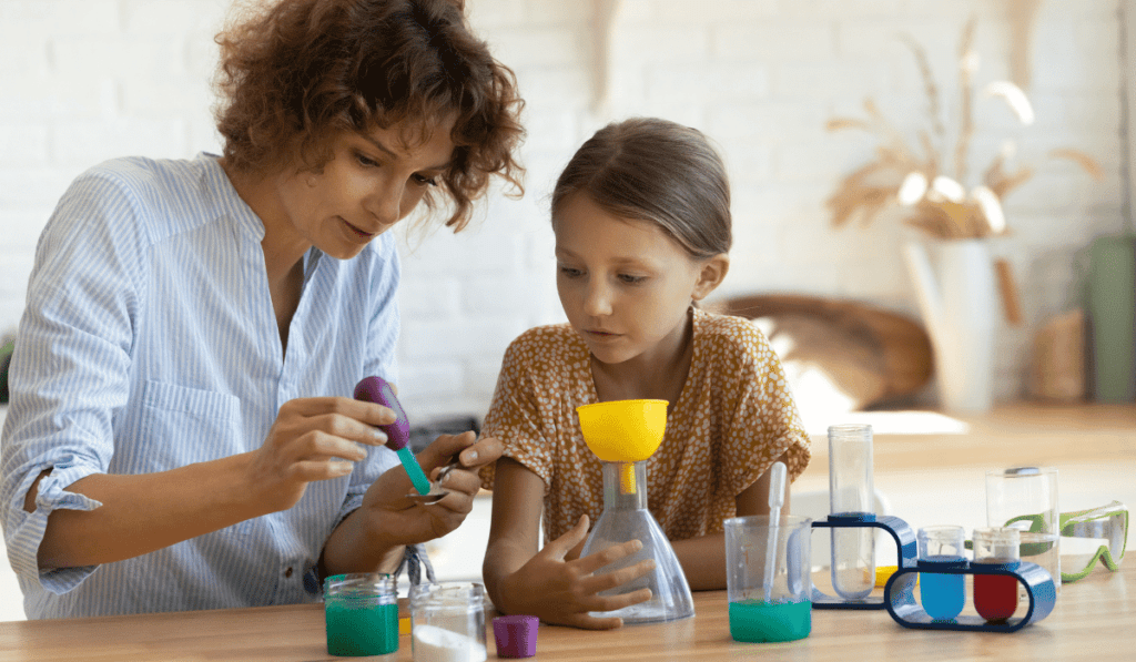 Mother and Daughter performing a chemistry experiment. 