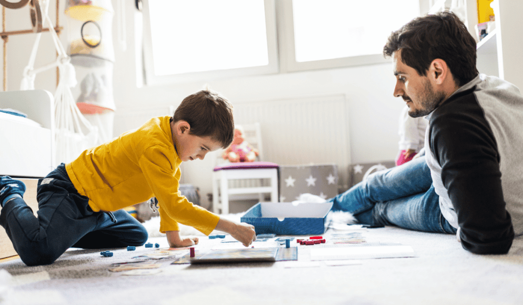 Father and son playing a board game.