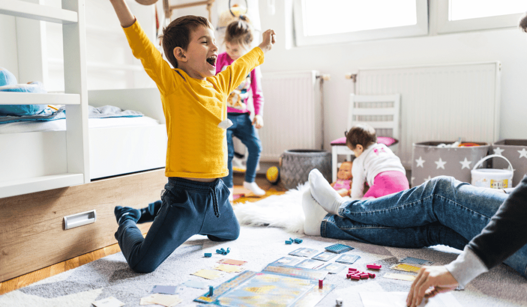 Boy celebrating his board game win. 