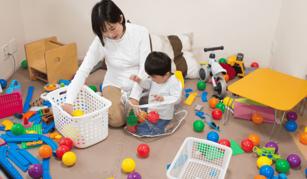 Mother engaging in stem toy play with their child. 