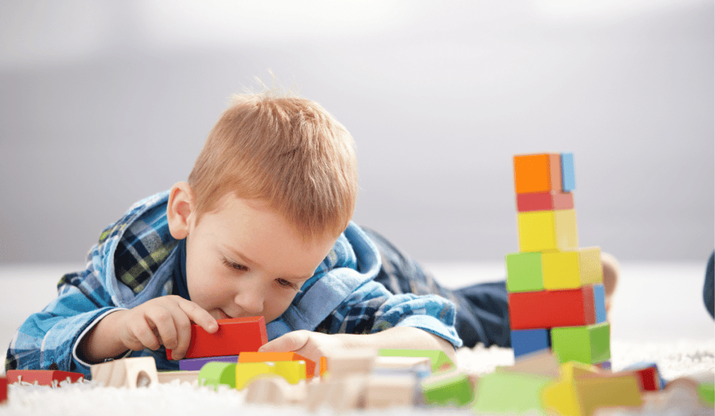 Image of boy playing with blocks.